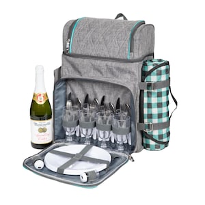 May include: A gray picnic backpack with teal accents, containing plates, cutlery, glasses, and a bottle of sparkling cider. A rolled-up picnic blanket with a teal and white checkered pattern is attached to the side.