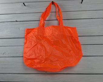 Geüpcycleerde neonoranje draagtas met parachuteschuiver