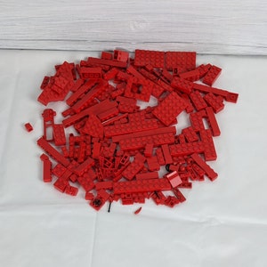 Assorted Red Lego Bricks and Accessories