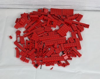 Assorted Red Lego Bricks and Accessories