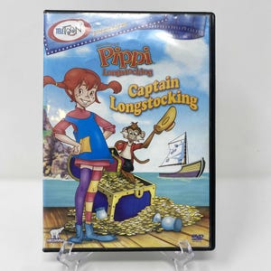May include: DVD of the animated film "Pippi Longstocking: Captain Longstocking." The cover features Pippi with red pigtails, a monkey, a treasure chest, and a sailboat. The DVD case is in a clear plastic holder.