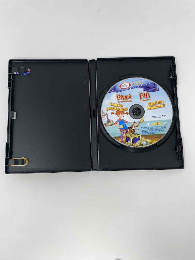 May include: Open black DVD case with a disc featuring the animated character Pippi Longstocking. The disc has the title "Pippi Longstocking" and "Captain Longstocking" in English. The disc art shows Pippi with treasure.