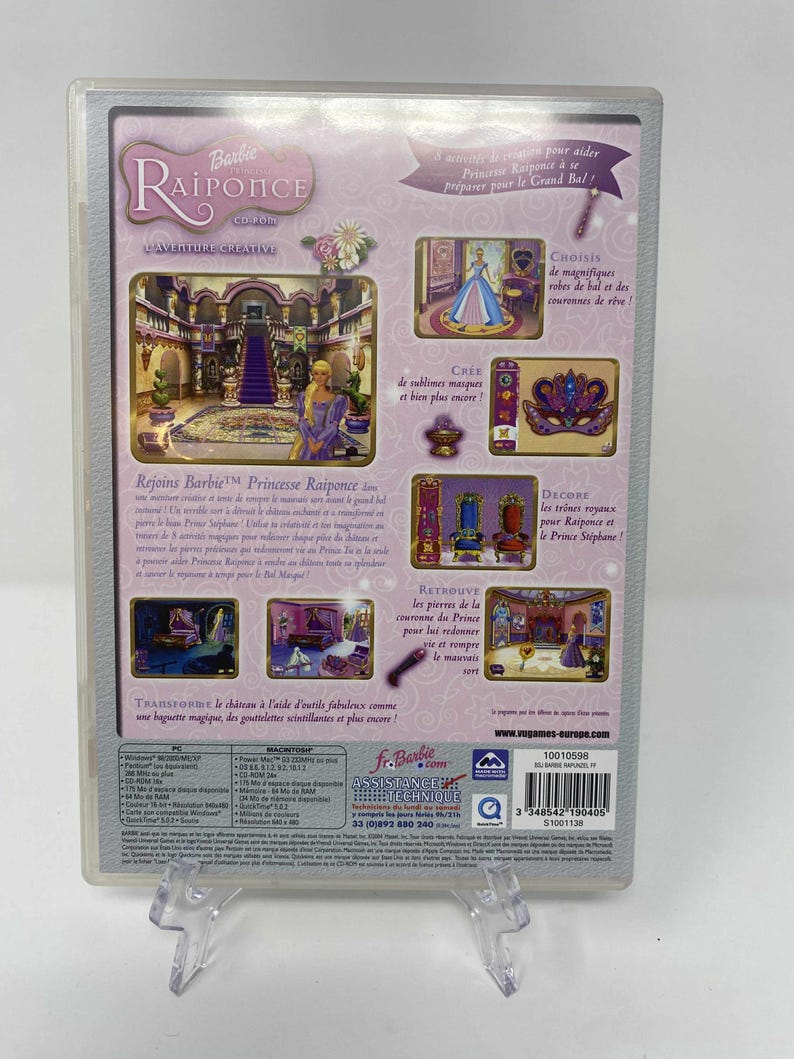 May include: A Barbie Raiponce CD-ROM game case. The back of the case features images of a princess, a castle, and various decorative elements. Text includes "Rejoins Barbie Princesse Raiponce" and "Transforme le ch&acirc;teau".