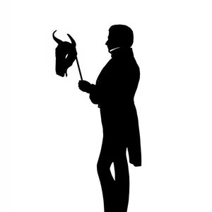 May include: A black silhouette of a person holding a bull's head mask on a stick. The person is wearing a long coat and pants. The image is set against a white background.