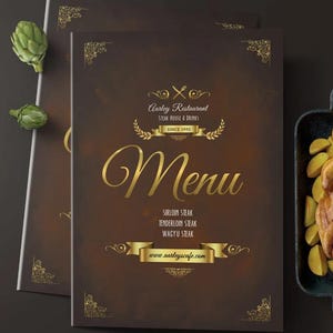 May include: A brown menu with gold lettering and accents. The menu reads "Aarley Restaurant Steak House & Drinks Since 1990" and lists steak options. The website www.aarleyscafe.com is also displayed.