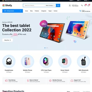 May include: A website homepage for an online store called "Shofy" featuring a sale on tablets. The text "The best tablet Collection 2022" is displayed in large font. Two tablets are shown in the image, one is black and the other is white. The text "Exclusive offer -35% off this week" is displayed below the tablets. The website also features a variety of other products, including headphones, mobile phones, CPU heat pipes, smart watches, and Bluetooth devices.