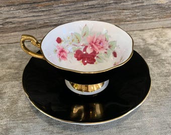Queen&#39;s Fine Bone China Made in England.  Black and Gold with Roses teacup and saucer