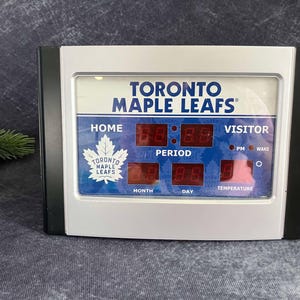 Toronto Maple Leafs Alarm Clock mit Temperatur, Monat und Tag, getestet, funktioniert. 23x16cm