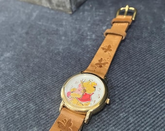 vintage Timex Pooh watch with leather band and butterfly second hand. very nice.