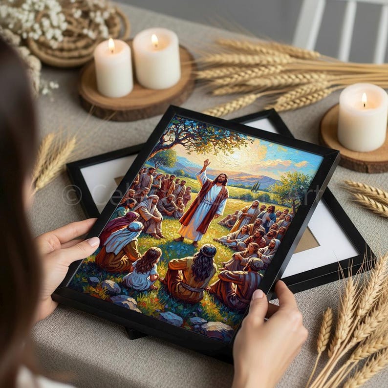 May include: A framed religious artwork depicts a biblical scene with a central figure in a white robe addressing a crowd. The artwork features vibrant colors, with a focus on the central figure and the surrounding landscape. The frame is black.