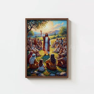 May include: A framed art print depicting a religious scene. A central figure in a white robe and red sash stands with an arm raised, addressing a crowd. The artwork features a vibrant landscape with a warm color palette.