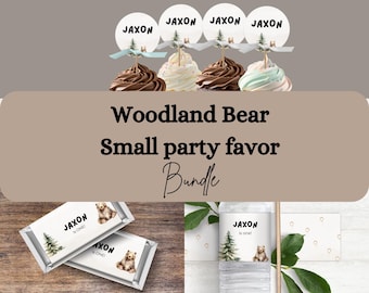 May include: Woodland bear themed party favor bundle with cupcake toppers, chocolate bar wrappers, water bottle labels, and favor tags. The toppers, wrappers, and labels feature a brown bear with a pine tree and the name Jaxon is one.