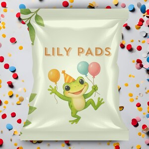 May include: A light green bag with the text "LILY PADS" in brown. The bag features a cartoon frog wearing a party hat and holding balloons. The background is decorated with colorful confetti.