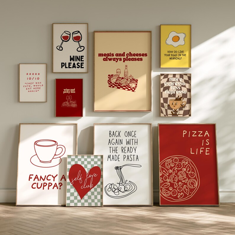 Framed retro kitchen print with bold red typography 'meats and cheeses always pleases' and a charcuterie basket illustration.
