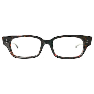 May include: Rectangular eyeglasses with a tortoiseshell pattern. The frames are dark brown with red and black accents. The lenses are clear, and the temples are thin and silver.
