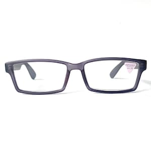 May include: Rectangular, dark gray eyeglasses with clear lenses. The frames have a subtle, matte finish. A small sticker on the right lens reads "Aspheric +1.75". The glasses are designed for vision correction and are suitable for everyday use.