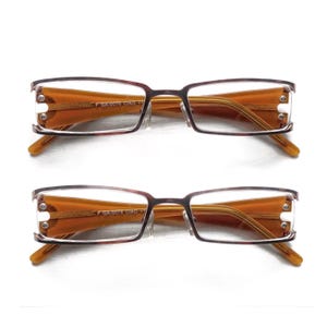 May include: A rectangular wooden sign, distressed for a rustic look, bearing the handwritten text "Welcome to our home". The sign is designed for home decor, suitable for indoor or outdoor use, with a simple and welcoming aesthetic.