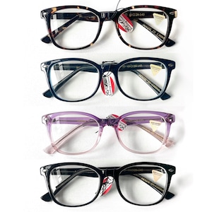May include: Four pairs of spectacles with clear lenses are shown. The frames are in tortoiseshell, navy blue, lavender, and black. Each pair has a tag that reads "RS-Able Reading Glasses".