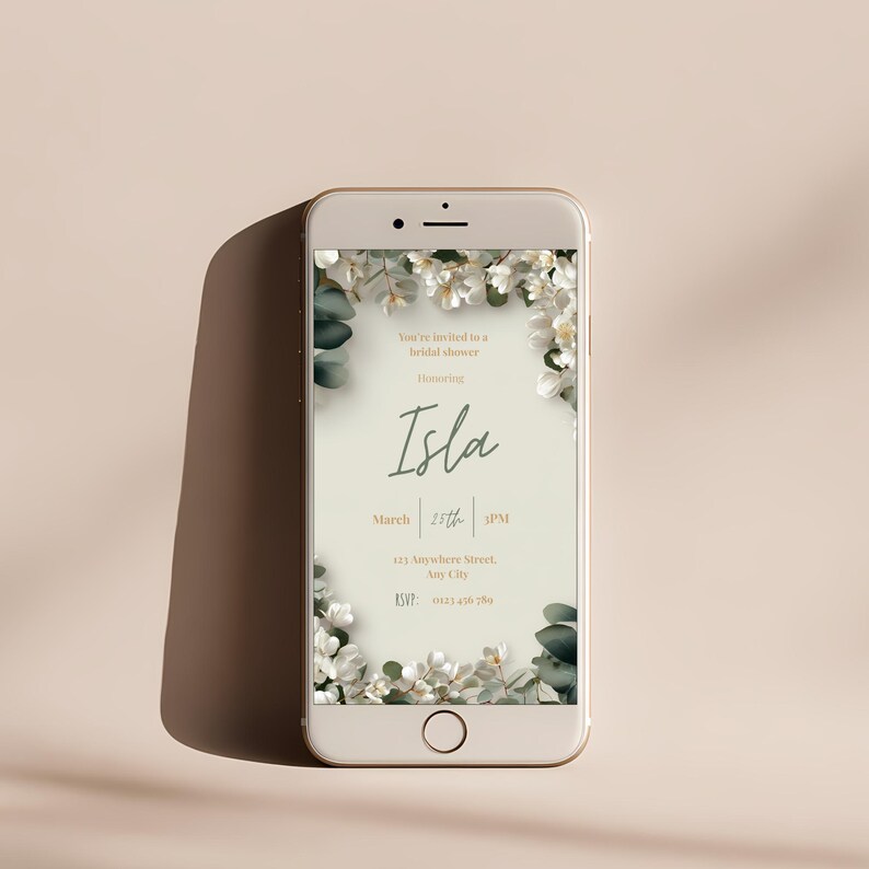 Editable bridal shower invitation displayed on mobile phone screen, white floral Canva template design