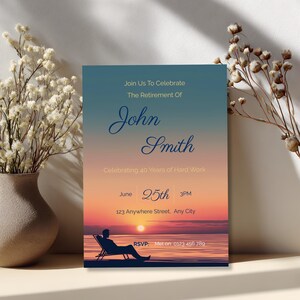 Printable retirement invitation for him propped against dried white flowers and vase, beach sunset silhouette design with script name typography, elegant mens retirement party invite