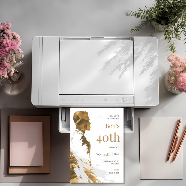 Printed mens birthday invitation coming out of a printer with gold artistic male silhouette and clean modern typography