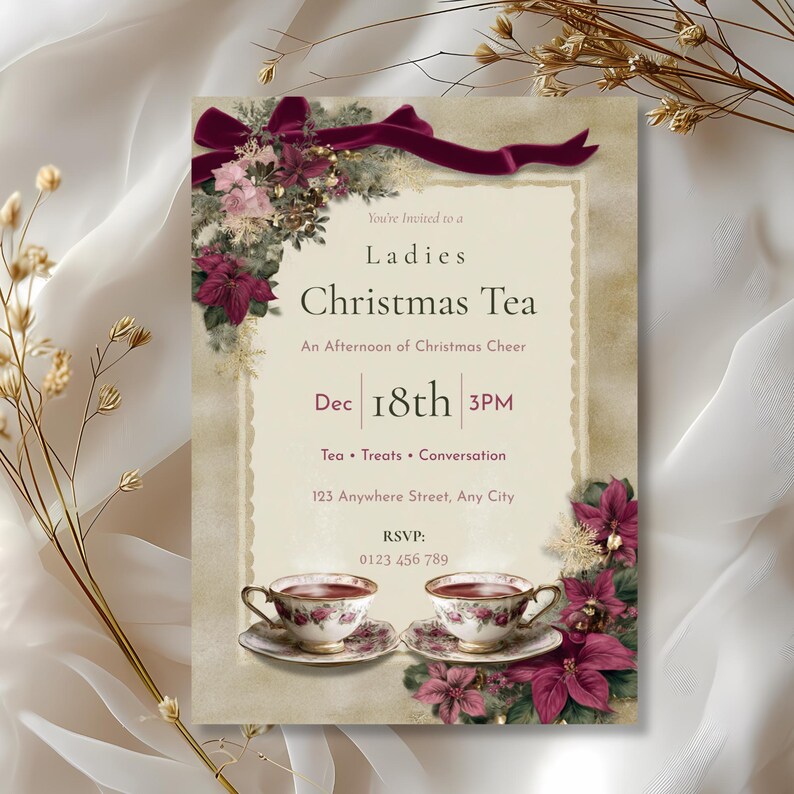 Ladies Christmas Tea invitation styled among dried gold florals and sheer ribbon for an elegant holiday look