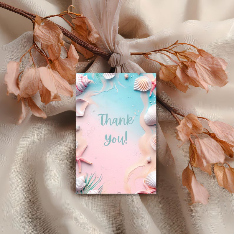 May include: A pastel-colored greeting card with a beach theme. The card features seashells, starfish, and the words "Thank you!" in a soft, elegant font. The background has a gradient of blue and pink, evoking a seaside scene.