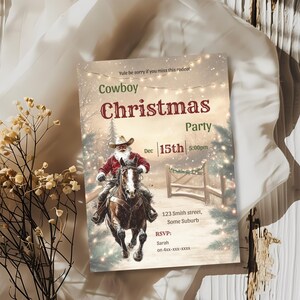 Cowboy Christmas party invitation styled with dried gold botanicals, a rustic Santa on horseback design perfect for a western holiday hoedown.