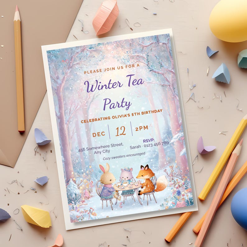 Printable kids winter tea party invitation on a craft table with colored pencils and an envelope, editable Canva birthday invite for a little girl