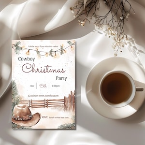 May include: A rectangular invitation card featuring a watercolour illustration of a brown cowboy hat, a wooden fence, pine branches, and string lights. The text reads Cowboy Christmas Party, Dec 15th, 5:00pm, 123 Smith street, Some Suburb, and RSVP: Sarah on 4xxx-xxx-xxxx.