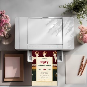 Ugly sweater party invitation coming out of a home printer, showing the template can be printed at home.
