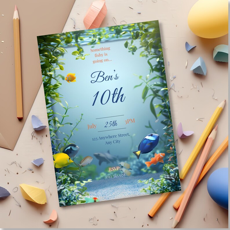 Close-up of aquarium invitation showing clownfish, blue tang, and clean center space for birthday details