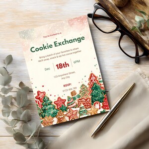 Cookie Exchange invitation styled on a wooden desk with glasses, a pen, and eucalyptus leaves