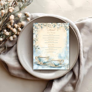 Winter tea party menu card on a place setting with cutlery, editable Canva template for afternoon tea