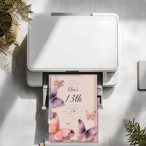 Editable Canva butterfly birthday invitation with gold frame and floral corners