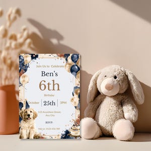 Puppy birthday invitation propped beside a plush bunny toy, navy and rust watercolor dog party invite