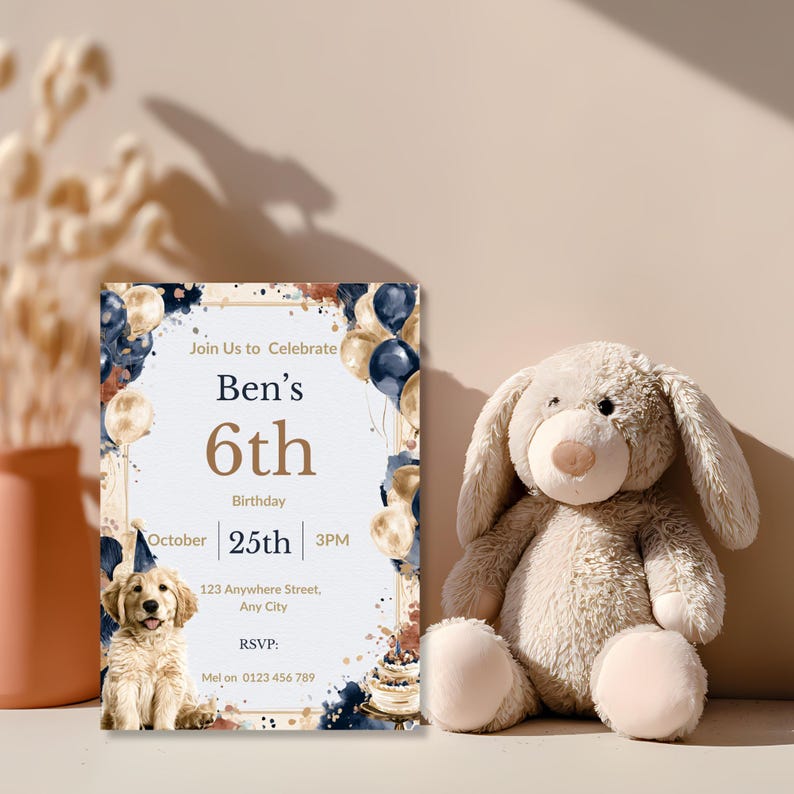 Puppy birthday invitation propped beside a plush bunny toy, navy and rust watercolor dog party invite
