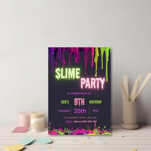 Printable slime birthday invitation on a craft desk with colored pencils, stickers, and party supplies.