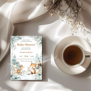 Winter woodland baby shower invitation card styled with a cup of tea and dried flowers