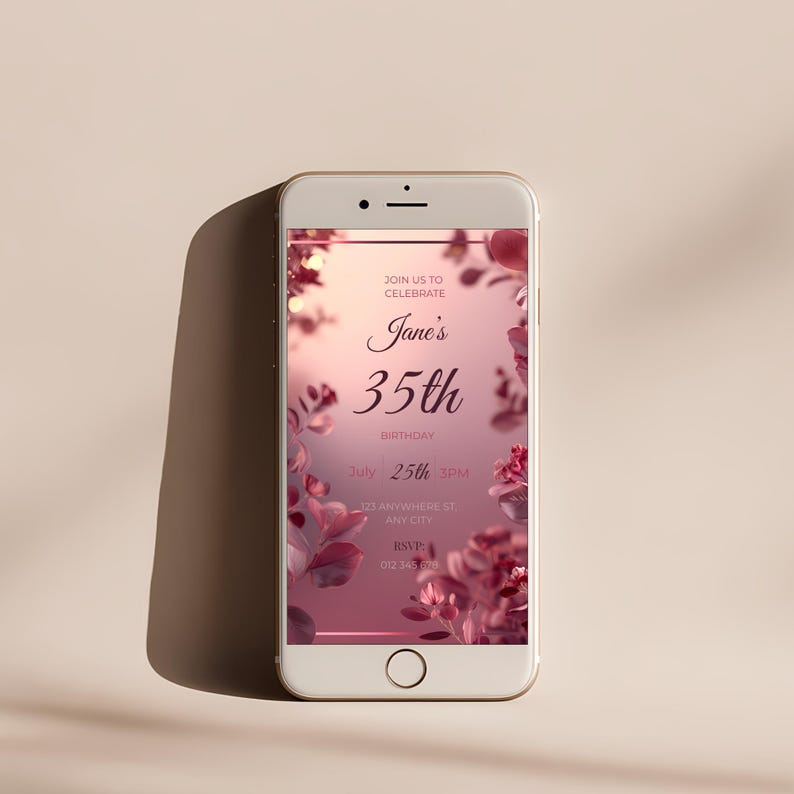 Elegant pink floral birthday invitation displayed on a mobile phone screen, editable Canva template.