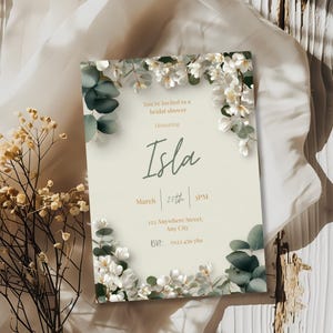 Minimal botanical bridal shower invitation with white flowers and green leaves, editable invitation template