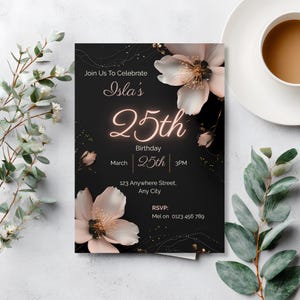 Elegant black 25th birthday invitation template with blush florals and neon glow number, styled in a flat lay with eucalyptus and a cup of tea, editable in Canva