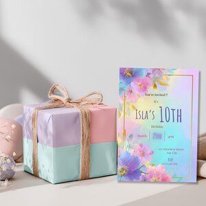 Pastel floral birthday invitation for girls shown next to pastel wrapped birthday gift, custom editable Canva template, digital download