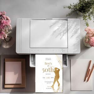 Printed minimalist golf birthday invitation with white marble background and gold accents