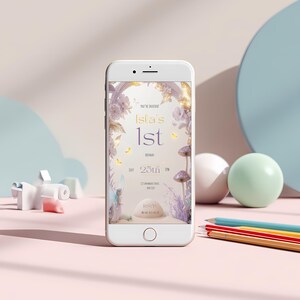 Fairy first birthday mobile invitation displayed on smartphone screen showing purple lavender enchanted mushroom fairy design 1080x1920 digital invite for sharing via text or WhatsApp
