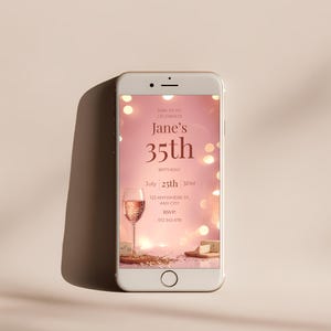 Editable birthday invitation shown on mobile phone screen, pink elegant Canva template for wine party birthday invite