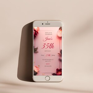 Editable birthday invitation displayed on mobile phone screen, pink floral Canva template for elegant women’s birthday party, digital invite option