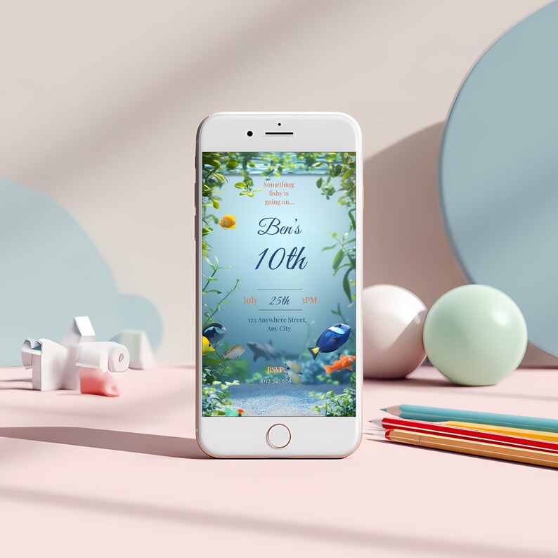 Editable aquarium birthday invitation shown on a smartphone screen with colourful fish tank design and clear text space