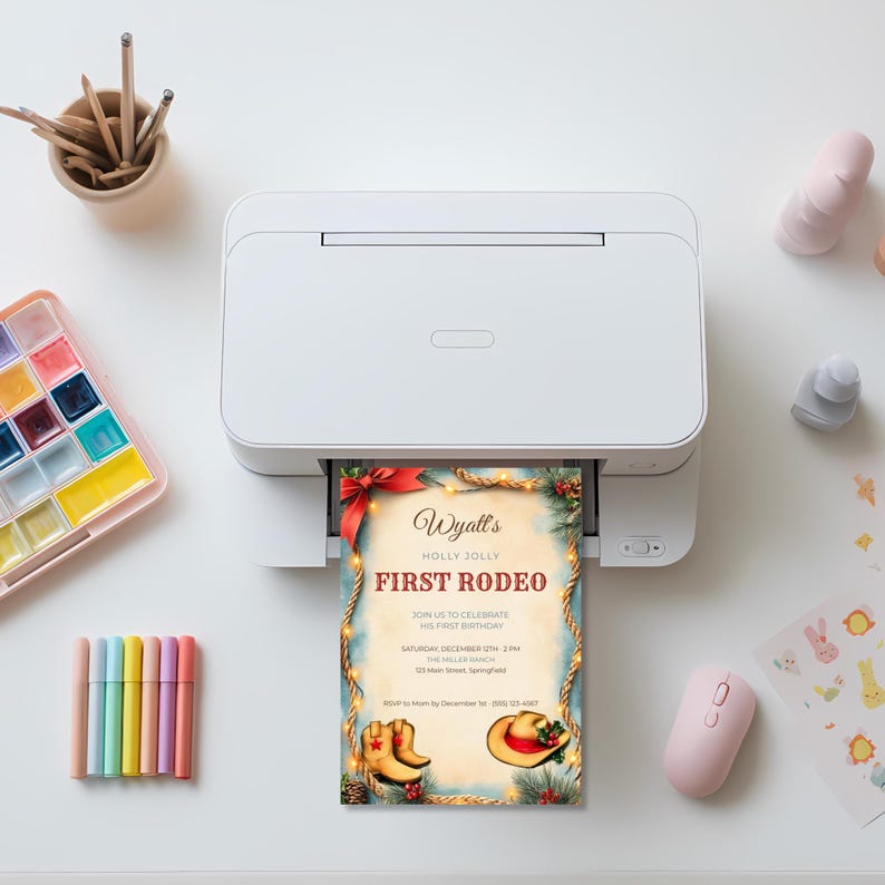 Printable first rodeo birthday invitation coming out of a home printer, ready to print at home or send to a local print shop