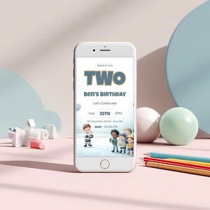 Ice hockey 2nd birthday invitation displayed on a mobile phone screen, showing “Slapshot Into TWO” editable Canva template with watercolor hockey scene